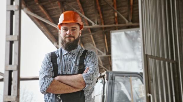 A custom builder at work with his arms folded